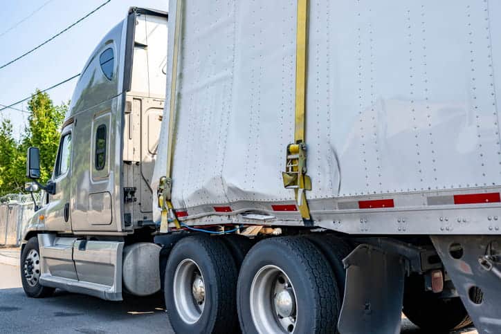 A damaged semi-truck after being in an accident.