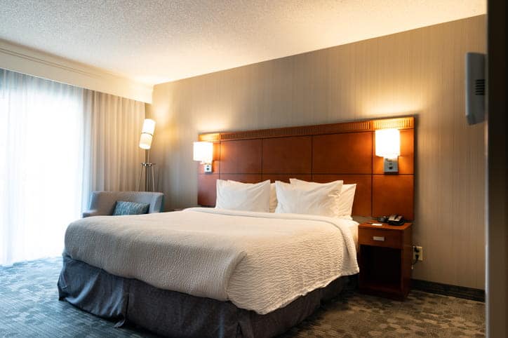 A photo of a bed inside a hotel room.