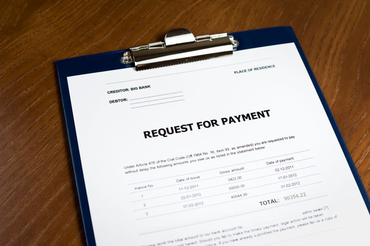 A clipboard with a form that's titled "request for payment. "