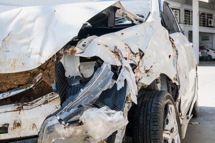 A severely damaged vehicle after a car accident.