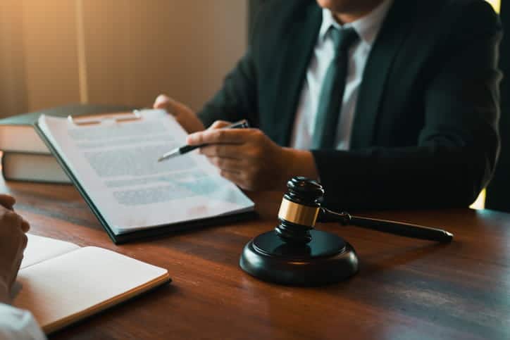 A personal injury attorney reviewing paperwork with a client.